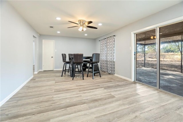 dining space featuring ceiling fan and light hardwood / wood-style floors