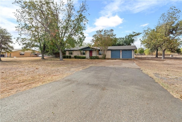 ranch-style home featuring a garage