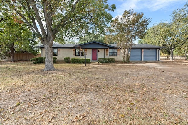 single story home with a garage