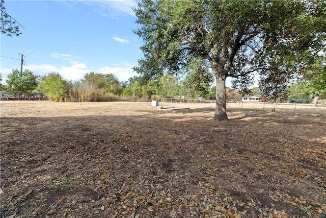 view of yard with a rural view