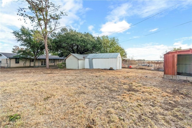 view of yard with an outdoor structure