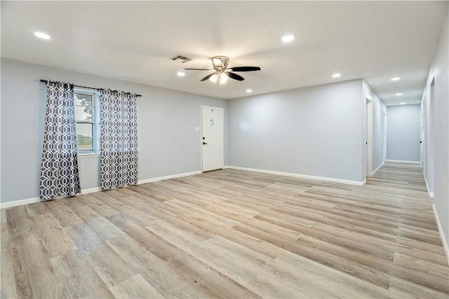 unfurnished room featuring ceiling fan and light hardwood / wood-style flooring