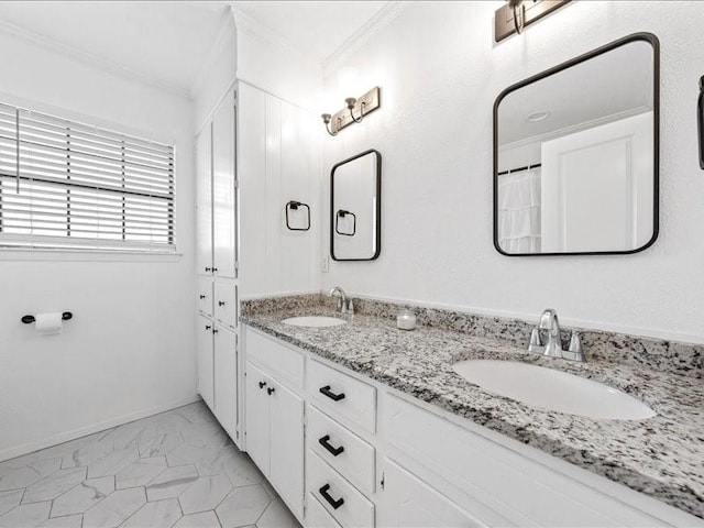 bathroom with ornamental molding and vanity