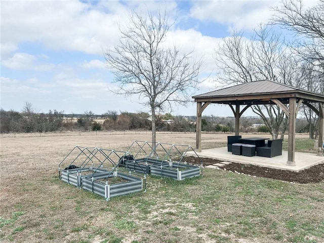 view of yard featuring a gazebo and a rural view