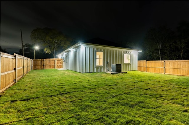 yard at twilight featuring central AC