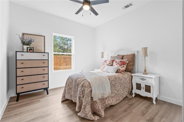 bedroom with ceiling fan and light hardwood / wood-style flooring