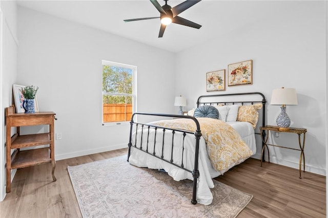 bedroom featuring ceiling fan and hardwood / wood-style flooring