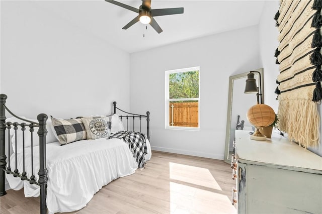 bedroom featuring light hardwood / wood-style flooring and ceiling fan