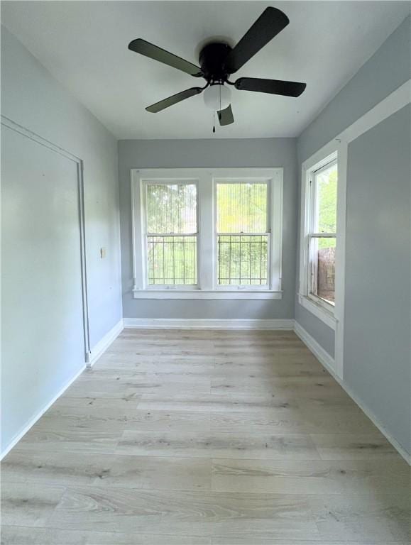 unfurnished room with light hardwood / wood-style floors and ceiling fan