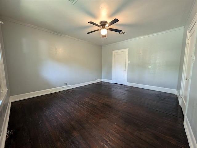 spare room with crown molding, ceiling fan, and dark wood-type flooring