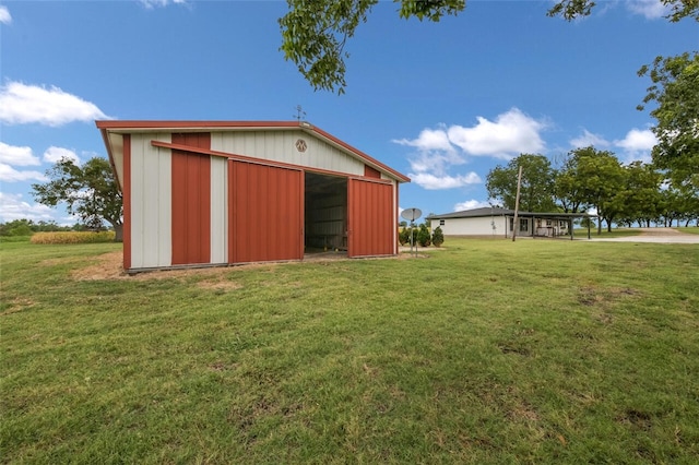 exterior space with a yard and an outdoor structure