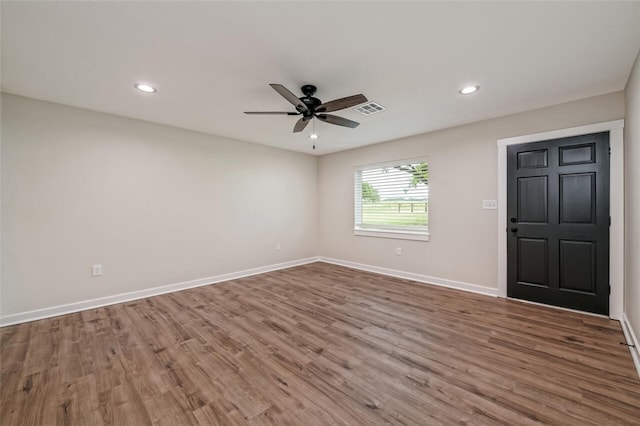 unfurnished room featuring hardwood / wood-style floors and ceiling fan