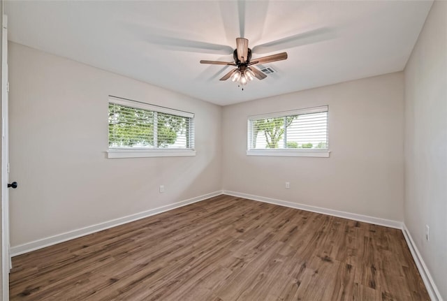 unfurnished room with ceiling fan and wood-type flooring