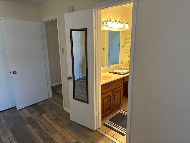 bathroom with wood-type flooring and vanity