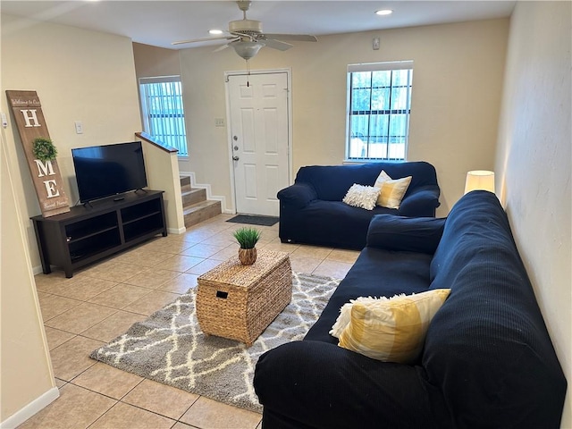 tiled living room featuring ceiling fan