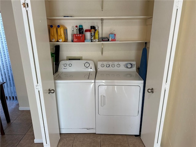 laundry area featuring separate washer and dryer and tile patterned floors