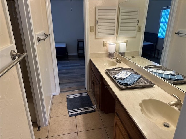 bathroom featuring tile patterned floors and vanity