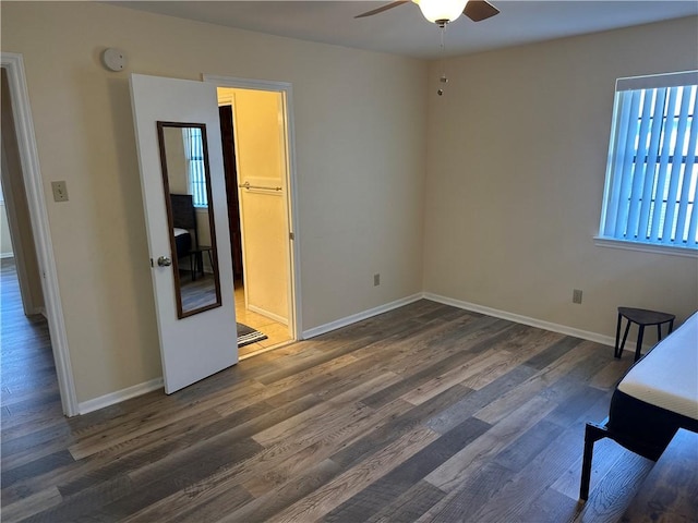 interior space featuring ceiling fan and dark hardwood / wood-style flooring