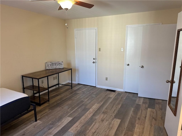 bedroom featuring dark wood-type flooring and ceiling fan