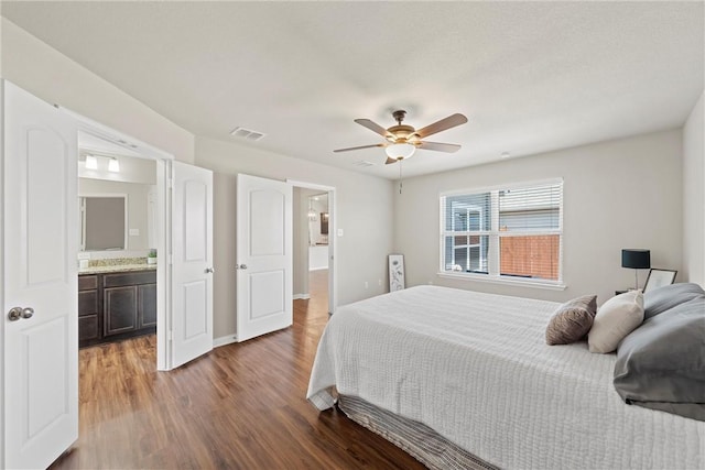 bedroom featuring connected bathroom, ceiling fan, and hardwood / wood-style floors