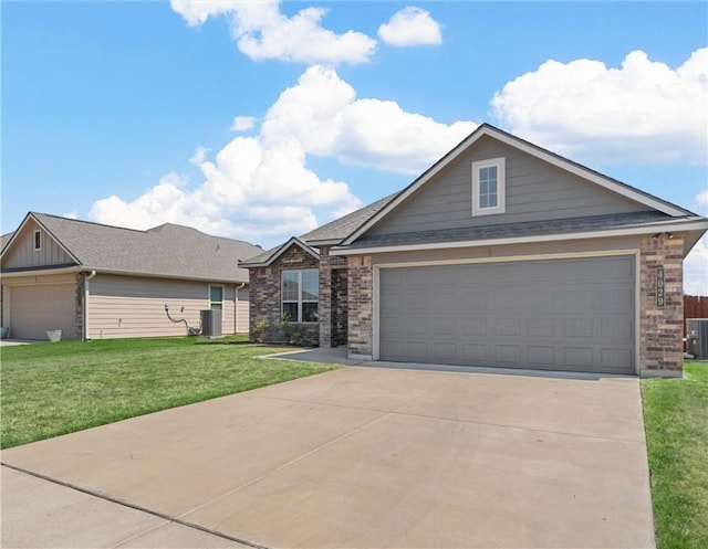 view of front of house with a garage, central air condition unit, and a front lawn