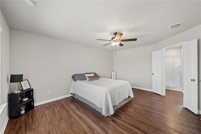 bedroom with ceiling fan and dark wood-type flooring