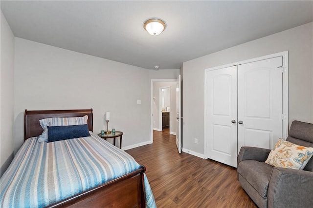 bedroom featuring dark hardwood / wood-style flooring and a closet