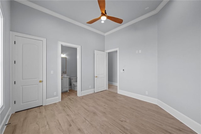 unfurnished bedroom featuring ensuite bath, ceiling fan, ornamental molding, and light wood-type flooring