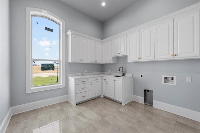 laundry area featuring hookup for an electric dryer, washer hookup, cabinets, and sink