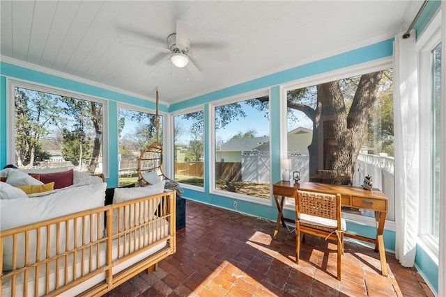 sunroom / solarium with ceiling fan and a wealth of natural light