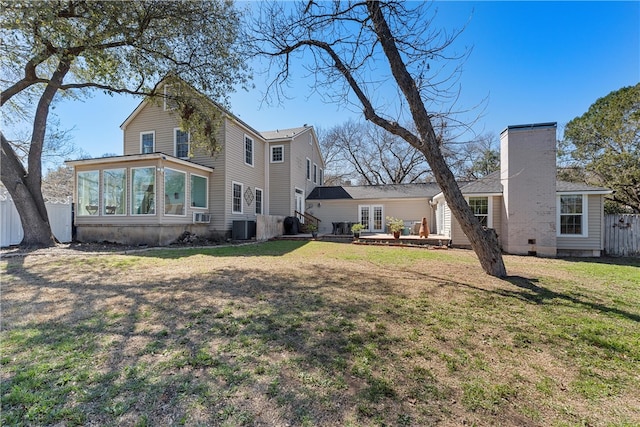 exterior space featuring a sunroom, french doors, fence, and central AC unit