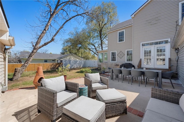 view of patio / terrace with french doors, outdoor lounge area, a grill, and a fenced backyard