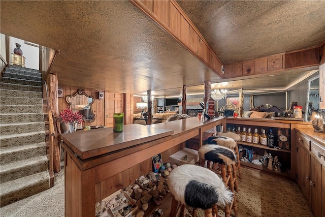 wine room featuring a textured ceiling