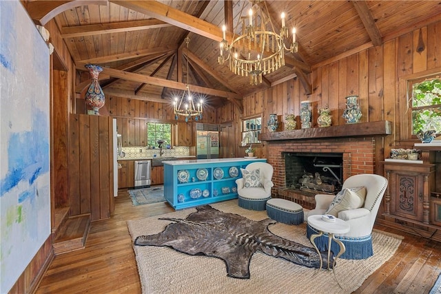 living room with wood ceiling, a fireplace, and light hardwood / wood-style flooring