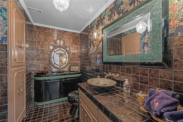 bathroom featuring crown molding, vanity, tile walls, and toilet