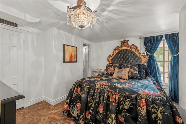 bedroom featuring a notable chandelier