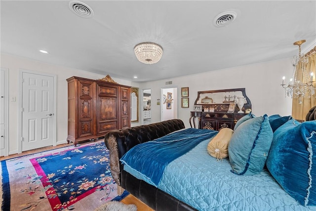 bedroom featuring an inviting chandelier