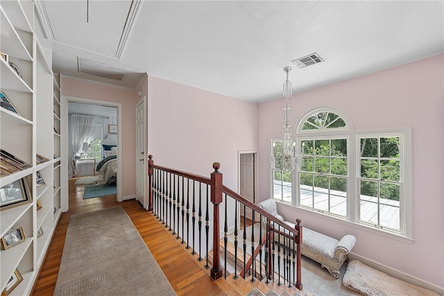 hallway with hardwood / wood-style flooring