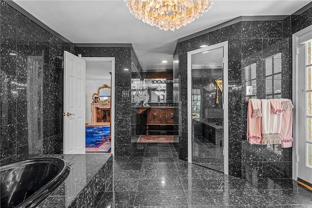 bathroom featuring vanity, crown molding, tile walls, a notable chandelier, and plus walk in shower