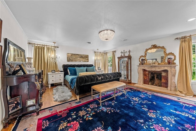 bedroom with wood-type flooring and crown molding