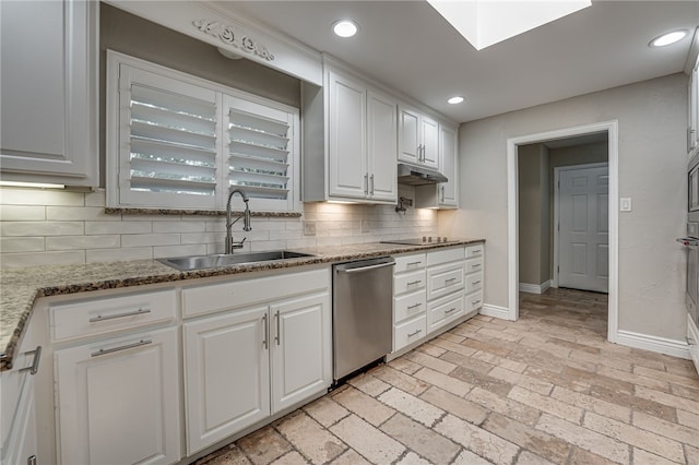 kitchen featuring white cabinetry, sink, stainless steel dishwasher, and stone countertops