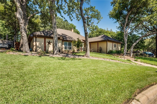 view of front of home with a front lawn