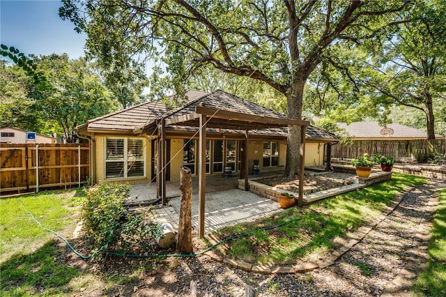 rear view of house with a patio