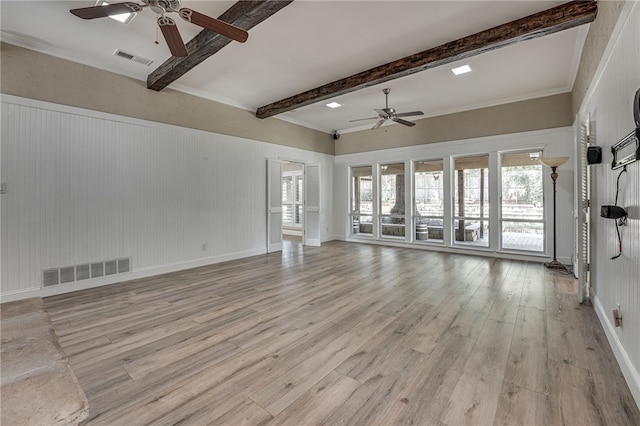 unfurnished living room with beam ceiling, light wood-type flooring, ceiling fan, and ornamental molding