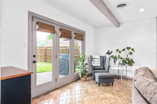 entryway with beamed ceiling