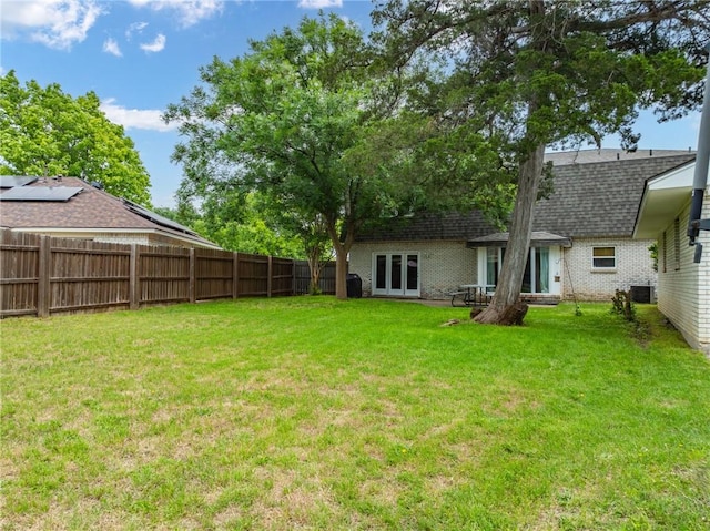 view of yard featuring french doors