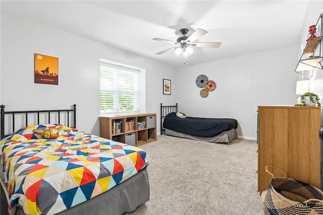 bedroom featuring ceiling fan and carpet