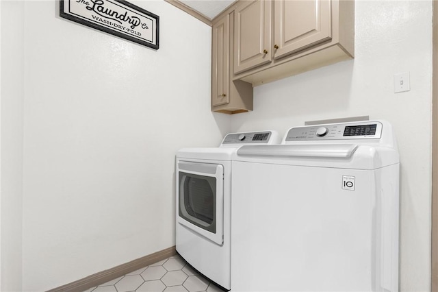 laundry room with cabinets and washing machine and dryer