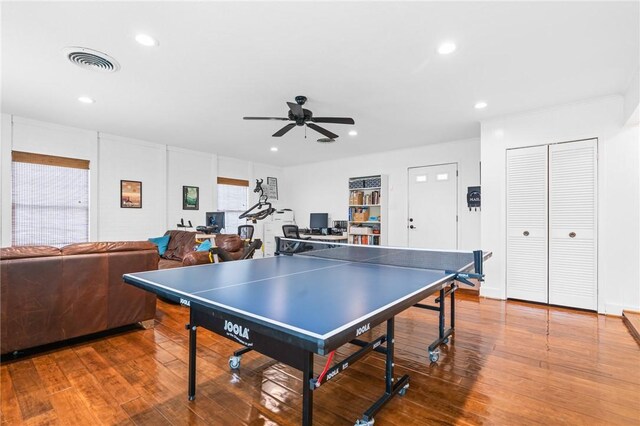 game room featuring wood-type flooring and ceiling fan