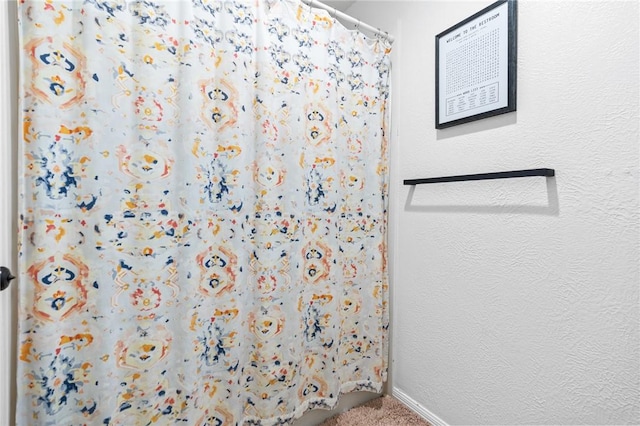 bathroom with a shower with curtain